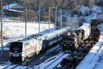 The NS yard job passes parked Amtrak train #20(2) on its way to work the First Brands plant in Amherst, VA.